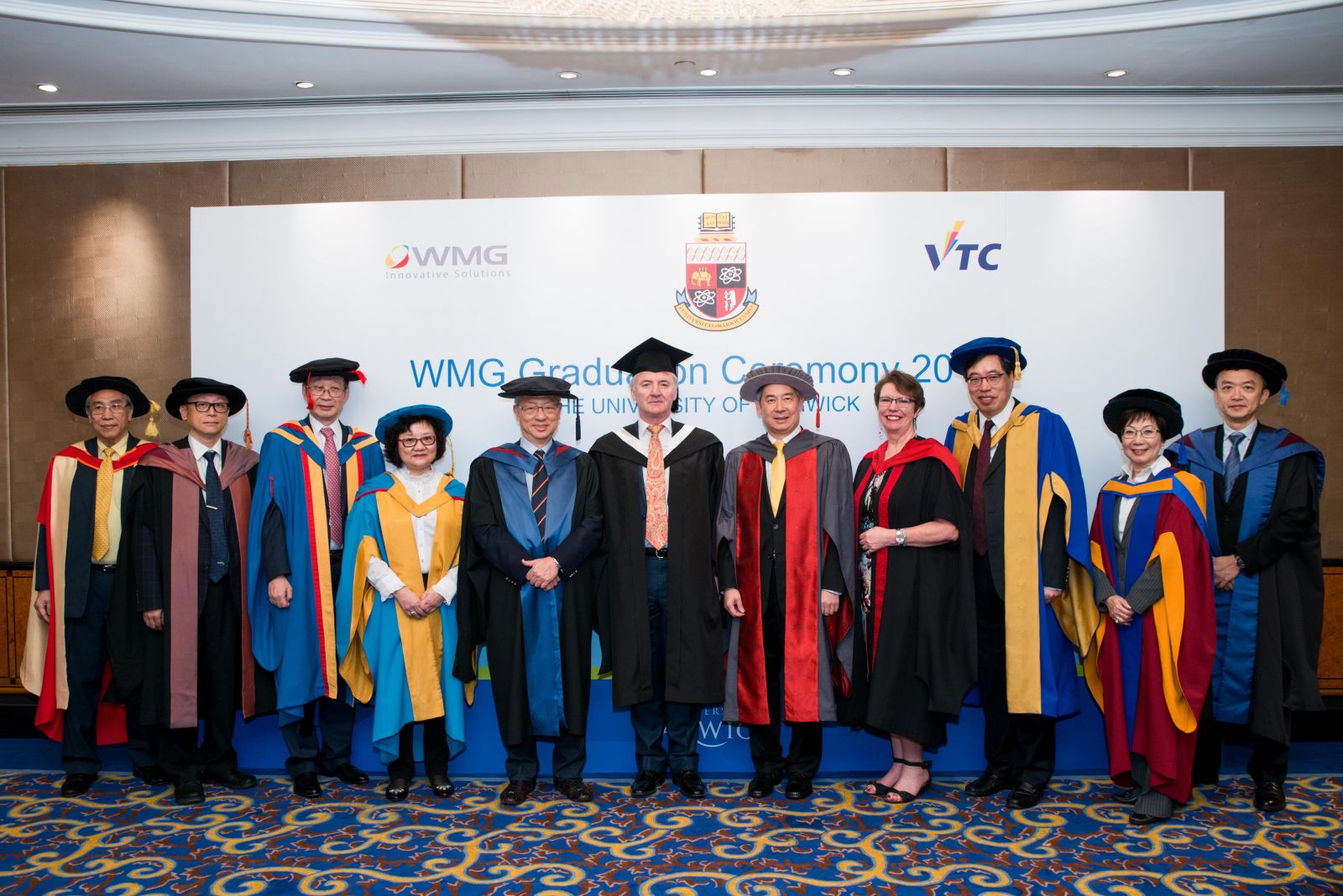 Officiating guests included Mr Robert NESS, Director of British Council Hong Kong (centre), VTC Chairman Dr Clement CHEN (fifth from right), Professor Amanda DOWD, Academic Director of Graduate Studies, WMG of the University of Warwick (fourth from right), VTC Deputy Chairman-cum-Chairman of WMG School for Professional Development Office Steering Group Prof Roy CHUNG (fifth from left) and VTC Executive Director Dr Carrie YAU (fourth from left)