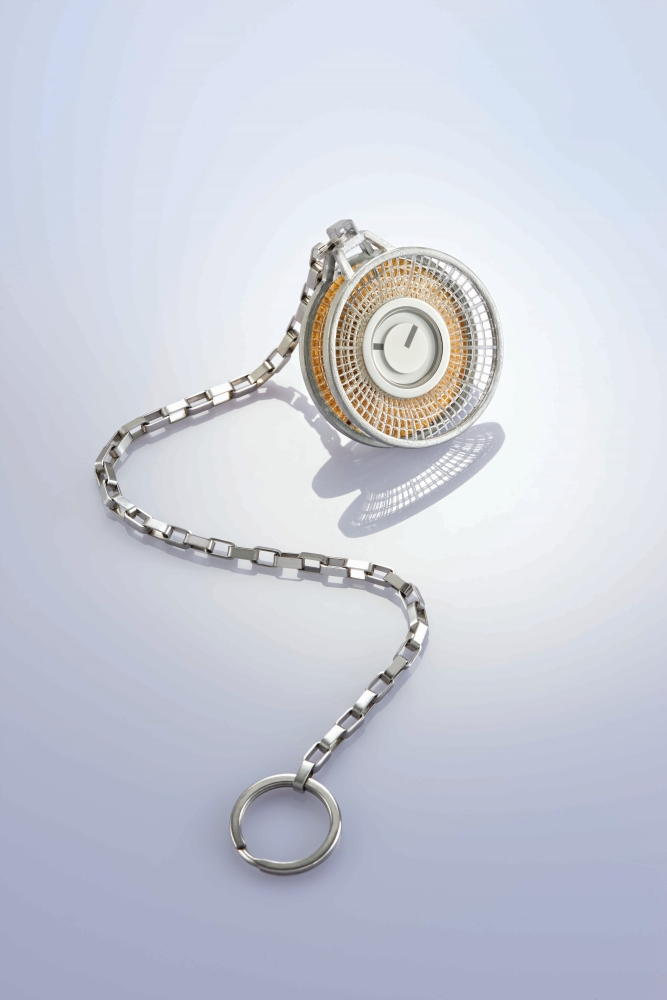 This year’s HKDI graduate of Higher Diploma in Jewellery and Image Product Design CHAN Wai-mau (centre) wins the second runner-up prize with his pocket watch design “Cherish”. (Photos provided by HKTDC)