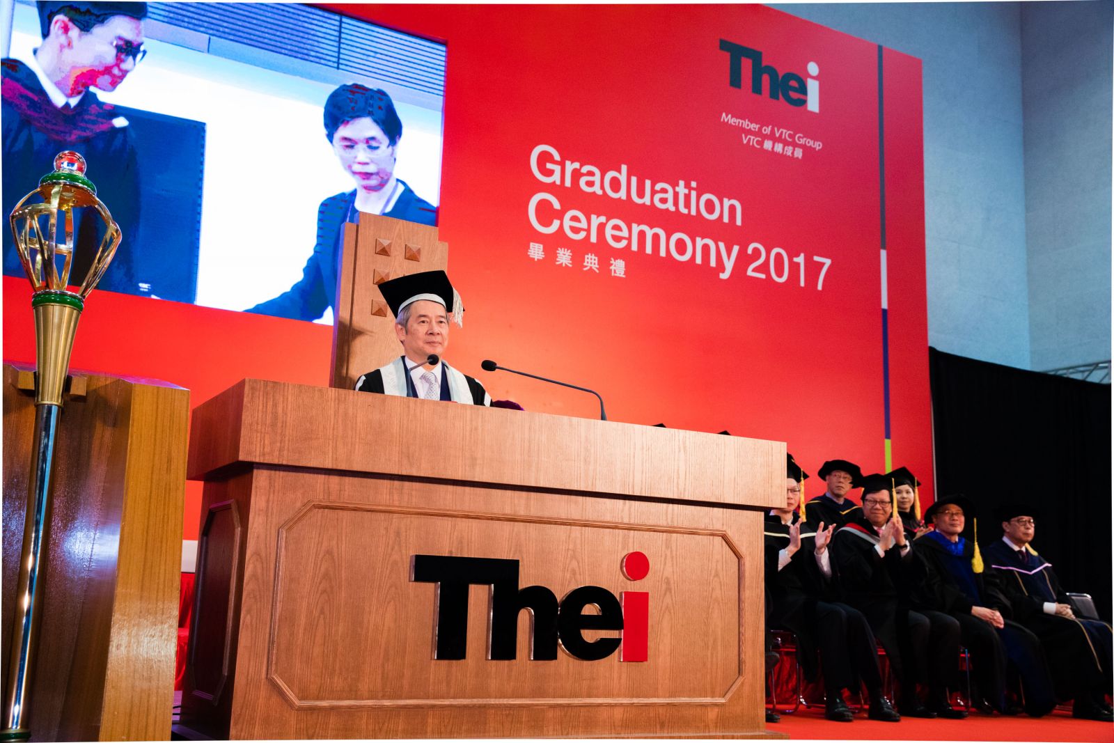 VTC Chairman Dr Clement CHEN presents degree certificates to the graduates, noting that in response to the society’s needs for professionals with specialised skills, VTC set up THEi to extend the value chain of VPET to degree level