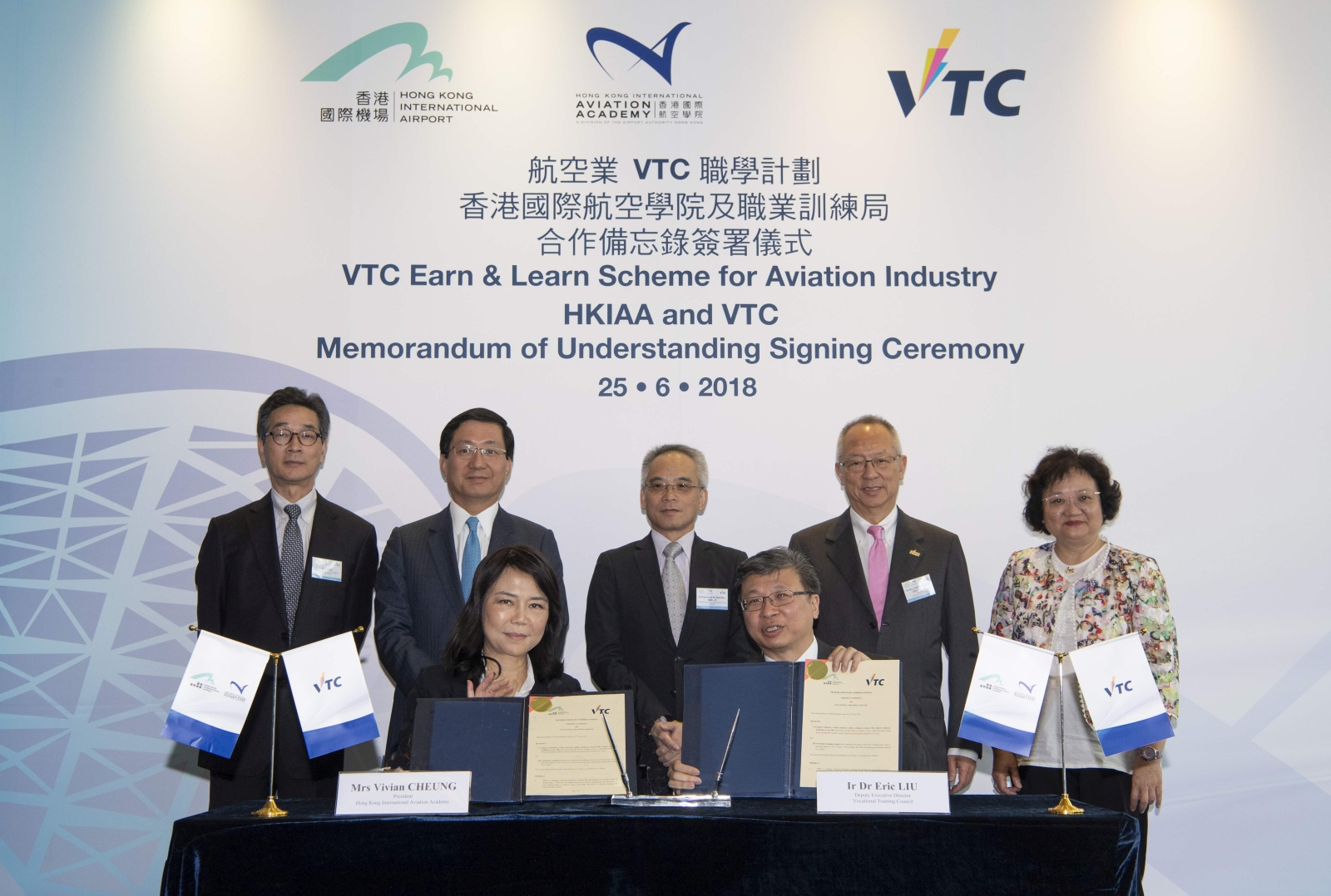 VTC Deputy Executive Director Dr Eric LIU (right on first row) and Hong Kong International Aviation Academy (the Academy) President Vivian CHEUNG (left on first row) sign the MoU to seal the joint collaboration in training manpower for the aviation industry