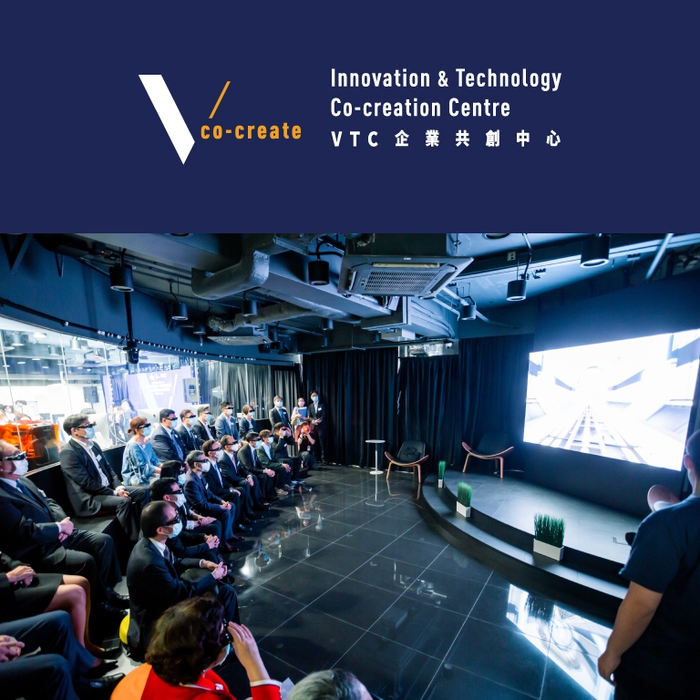 Audiences seated in Stage21 at the ITCC, a modern, high-tech room, are watching a 3D video on a large LED screen, with a focus on innovation and technology.